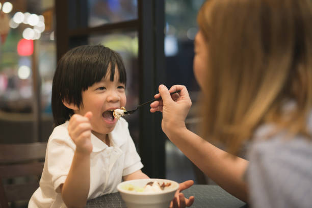 istock Mother and child eating ice cream 687371560