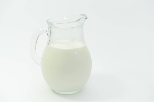 istock Fresh cow milk in a jar on a light background. 687378780