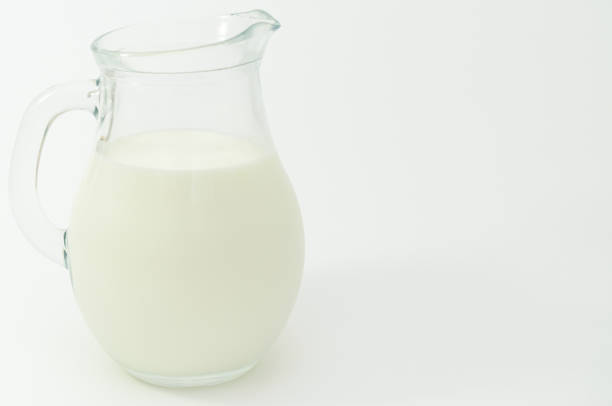 istock Fresh cow milk in a jar on a light background. 687378820