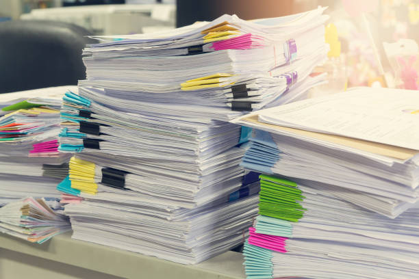 istock Pile of unfinished documents on office desk, Stack of business paper 687379092