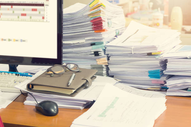 istock Pile of unfinished documents on office desk, Stack of business paper 687379162