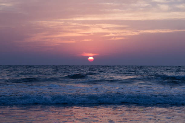 istock Amazing sunset at Arambol beach, North Goa, India 687382496