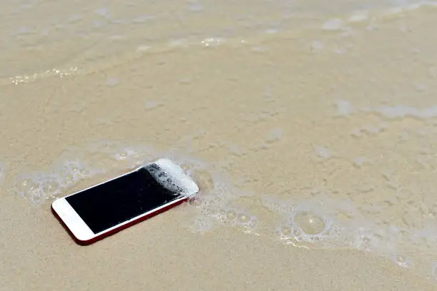 Photo of Lost Phone.Phone fell Disappear at beach for background