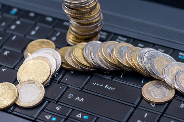 istock euro cin on laptop, business concept, close up 687413600