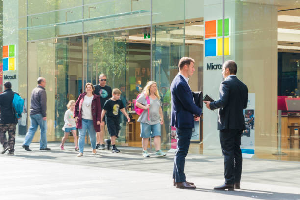 View of people visiting the Microsoft flagship store in Sydney Sydney, Australia - May 12, 2017: View of people visiting the Microsoft flagship store in Sydney. It is a retail store run y Microsoft, selling computers, software and electronic products. microsoft stock pictures, royalty-free photos & images