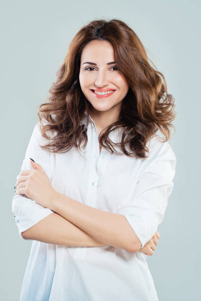 istock Cute Woman in White Cloth Smiling 687418102