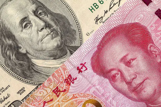 US dollar bill and China yuan banknote macro, Chinese and USA economy finance trade business, money closeup