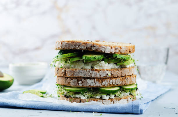 istock Ricotta sprouts avocado cucumber rye sandwich 687421176