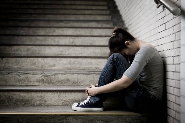 istock depressed woman in underground 687421268