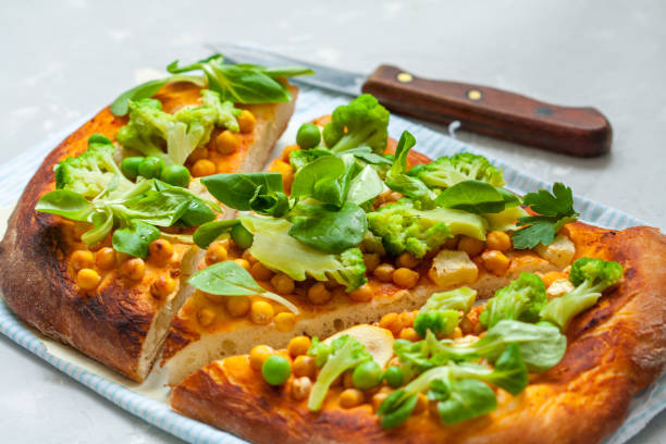 istock Vegan pizza with chickpeas and broccoli. 687421762