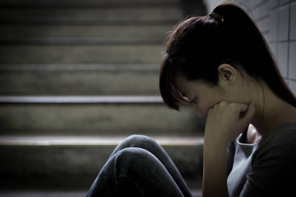 istock depressed woman in underground 687422408