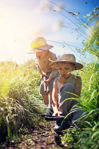 Little safari boys tracking imaginary animals