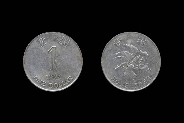 istock One dollar hongkong 1997 coin isolated on black background. 687429374