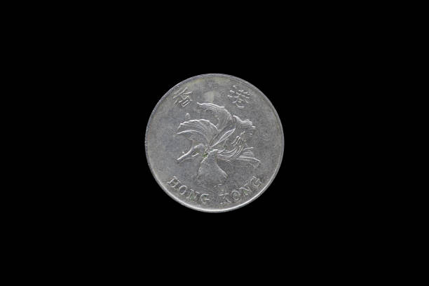 istock One dollar hongkong 1997 coin isolated on black background. 687433258