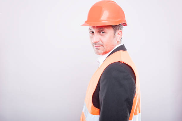 istock Side view of engineer wearing hardhat and reflective vest 687434646