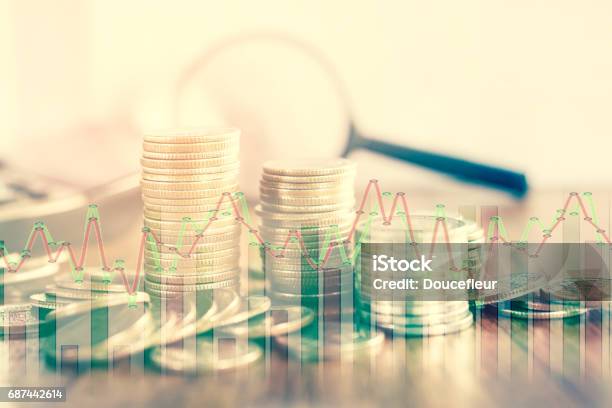 Double Exposure Of Coins And Stock Graph Business Concept In Vintage Tone Stock Photo - Download Image Now