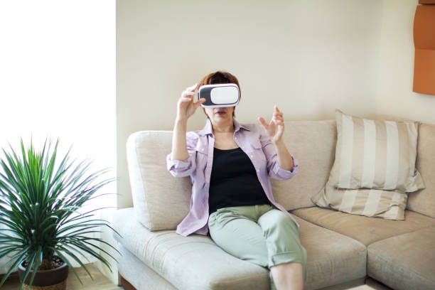 istock Senior woman in VR glasses 687444922