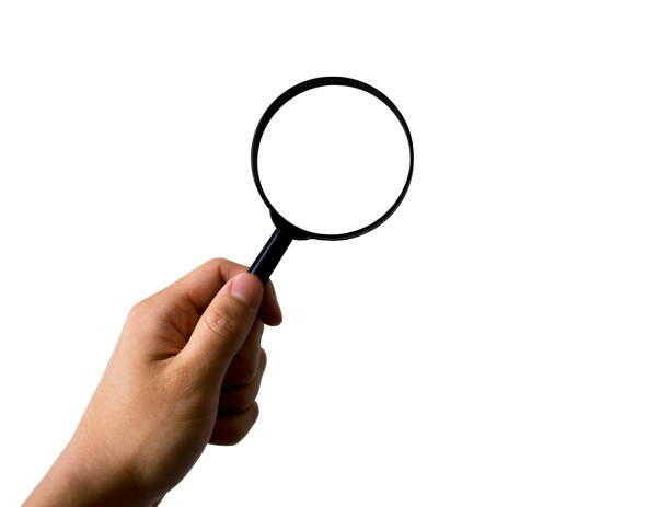 istock Hand holding magnifying glass, isolated on white background, with clipping path 687446560