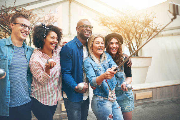 istock Friends taking selfie holding petanque balls 687450214
