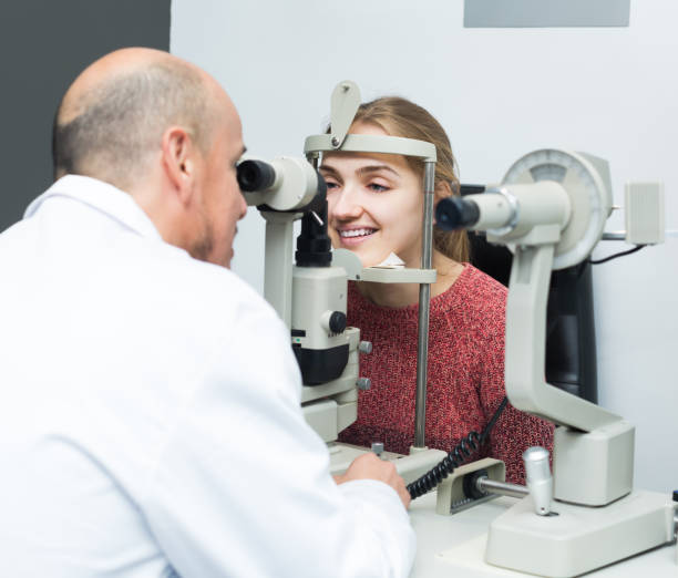 istock Ophthalmologist and woman checking eyesight 687471958