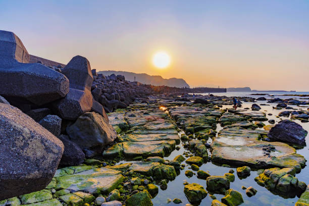 Seascape of waver barrier and sunset in Taiwan