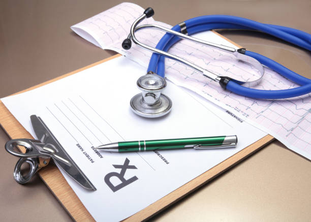 istock RX prescription, stethoscope and pen on white background. 687476248
