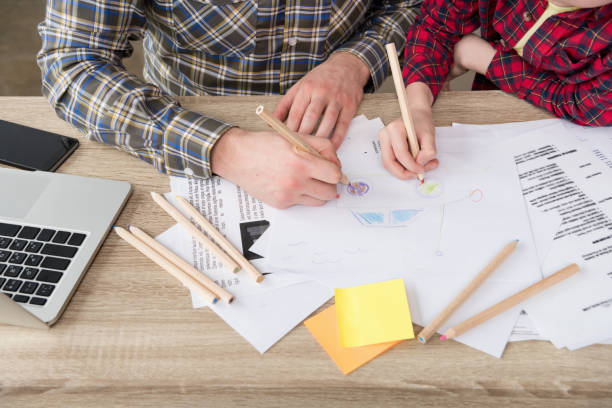 istock Businessman drawing with son at office 687479442