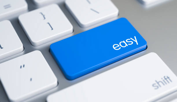Easy - Inscription on Blue Keyboard Key. 3D Easy Written on Blue Key of Metallic Keyboard. High Quality Render of a Modern Keyboard Button. The Button is Blue in Color and there is Caption Easy on It. 3D Render. smooth stock pictures, royalty-free photos & images