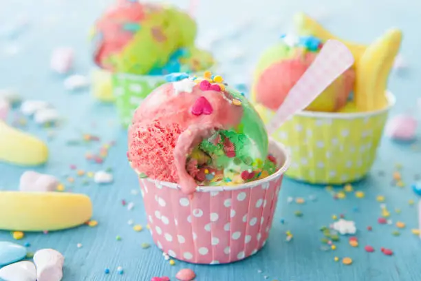Colorful ice cream with sugar sprinkles and marshmallows