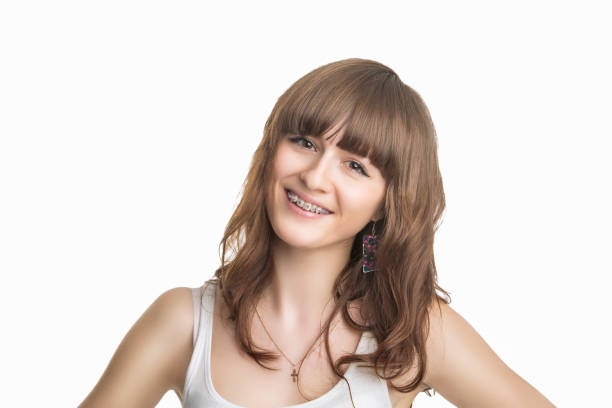 istock Beautiful Young Woman With Brackets on Teeth. 687483810
