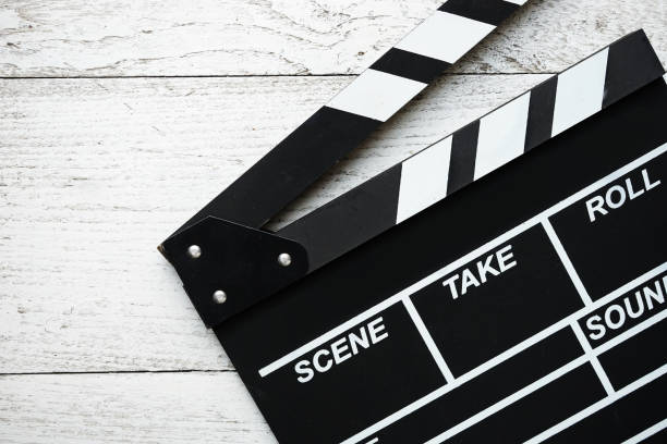 istock movie clapper on wood table 687488320