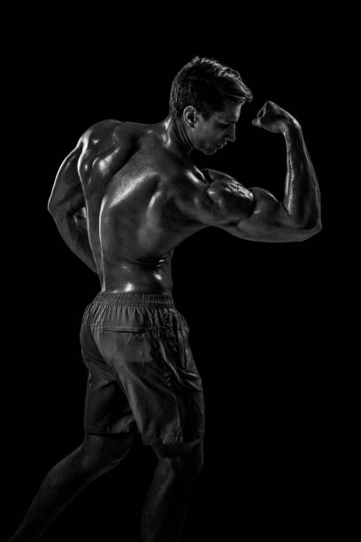 istock Strong Athletic Man Fitness Model posing back muscles, triceps o 687491662