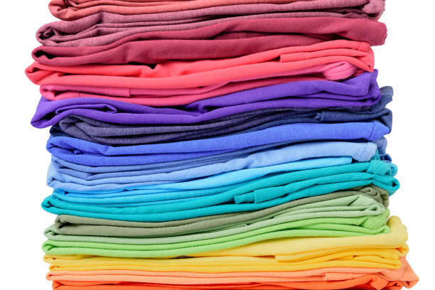 istock Stack of colorful t-shirt isolated on white background. File contains a path to isolation. 687497940