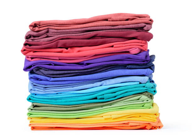 istock Stack of colorful t-shirt isolated on white background. File contains a path to isolation. 687497946