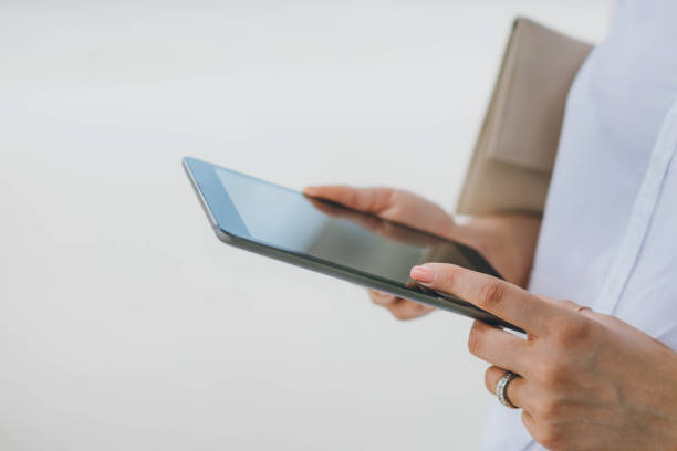 istock Close up of woman using digital tablet 687501534