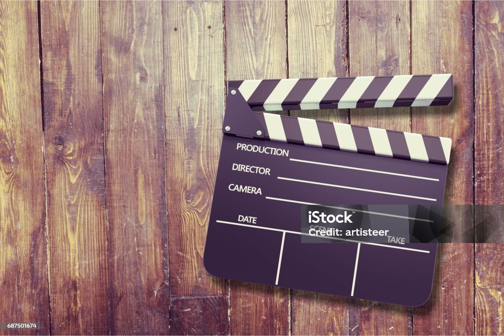 Film. Clap board on wooden background Film Slate Stock Photo