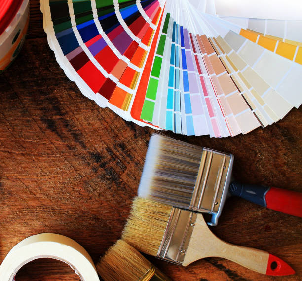 istock various painting tools and color palette on wooden background 687505294