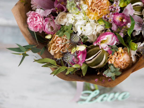 istock beautiful lush bouquet with different spring flowers, turquoise background, view from the top 687511046