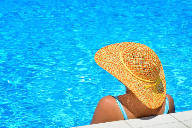 istock Real female beauty relaxing at swimming pool 687511304