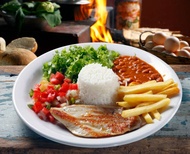 istock rice, beans, meat, chips and salad 687511788