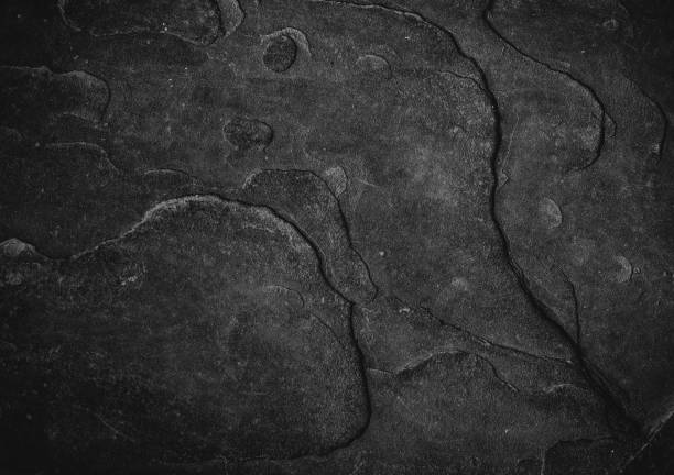 istock Cracked old stone wall background, stone grunge texture close up 687516554