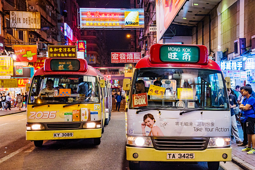 Hong Kong: This is a night scene of local buses in the Mong Kok shopping district area which is a crowded  busy area on April 24, 2017 in Hong Kong