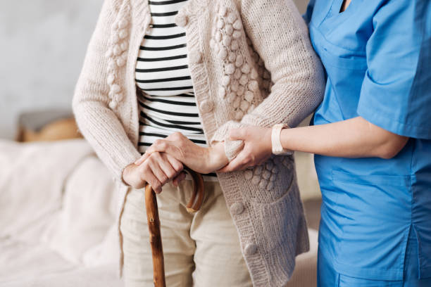 istock Gentle trained nurse helping mature patient 687520918