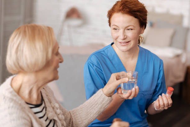 istock Hardworking kind doctor serving her patient pills 687523558
