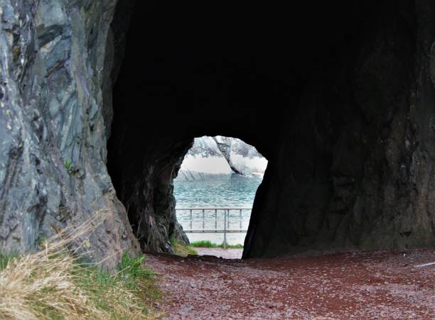 istock Tunnel carved through solid rock to allow for offloading cargo from ships, Brigus, Newfoundland and Labrador Canada. 687535620