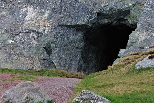 istock Tunnel carved through solid rock to allow for offloading cargo from ships, Brigus, Newfoundland and Labrador Canada. 687535666