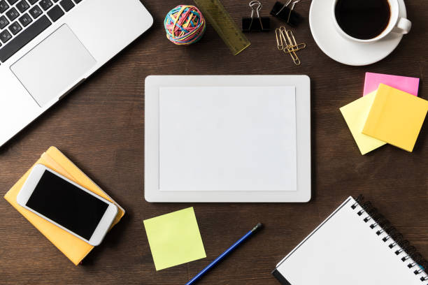 istock top view of tablet and other digital devices on home office table 687536050