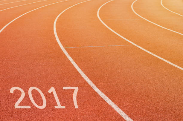 istock start in running track with text 2017 year, Start to new year 687536172