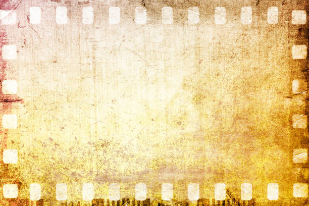 istock Vintage sepia film strip frame on old and damaged paper background. 687540714
