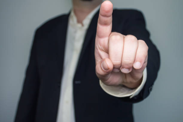 istock Man in suit with one finger up 687543450